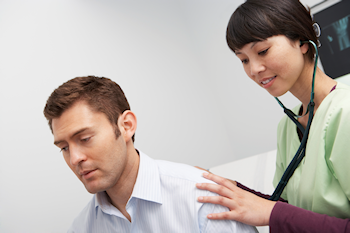 Health exam patient with doctor