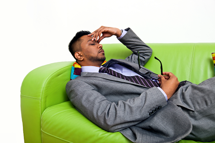 Man in suit on couch